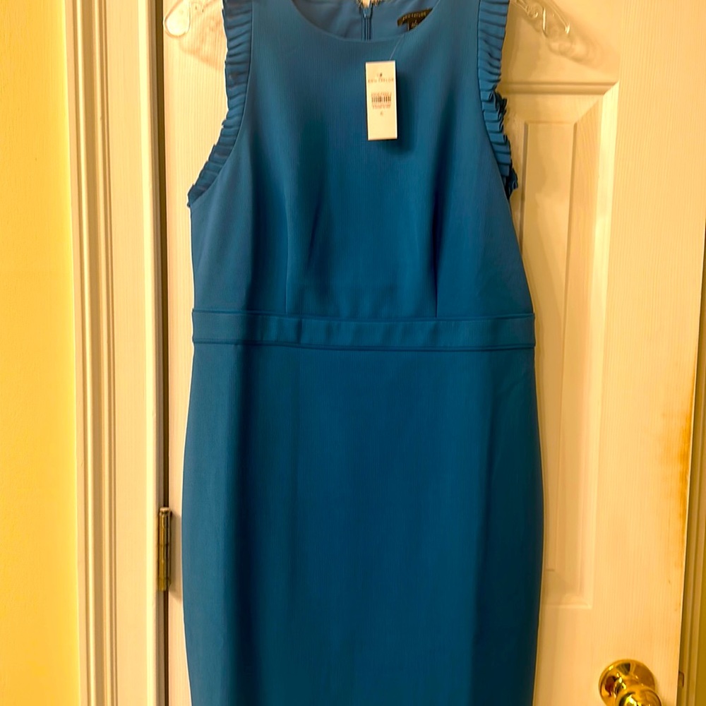 - Cerulean blue knee length sleeveless dress with pleated shoulder accent.